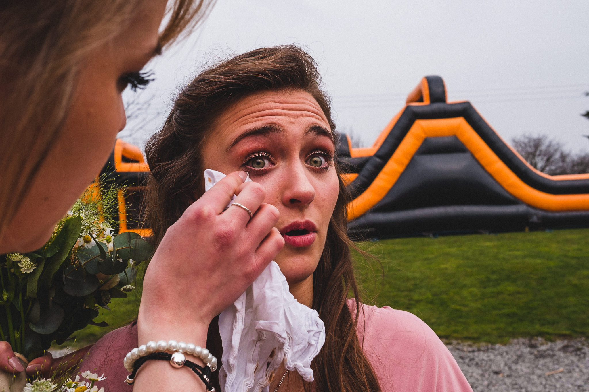 Bridesmaid crying at wedding