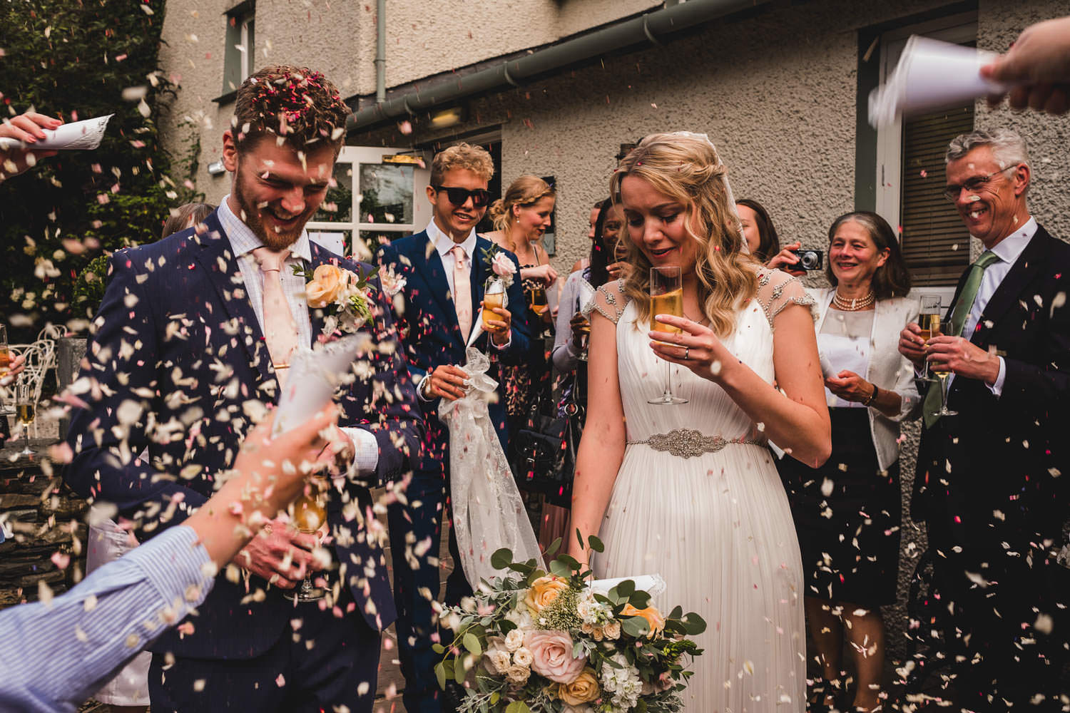 Confetti being thrown at wedding ceremony at The Punch Bowl Inn. Lake District