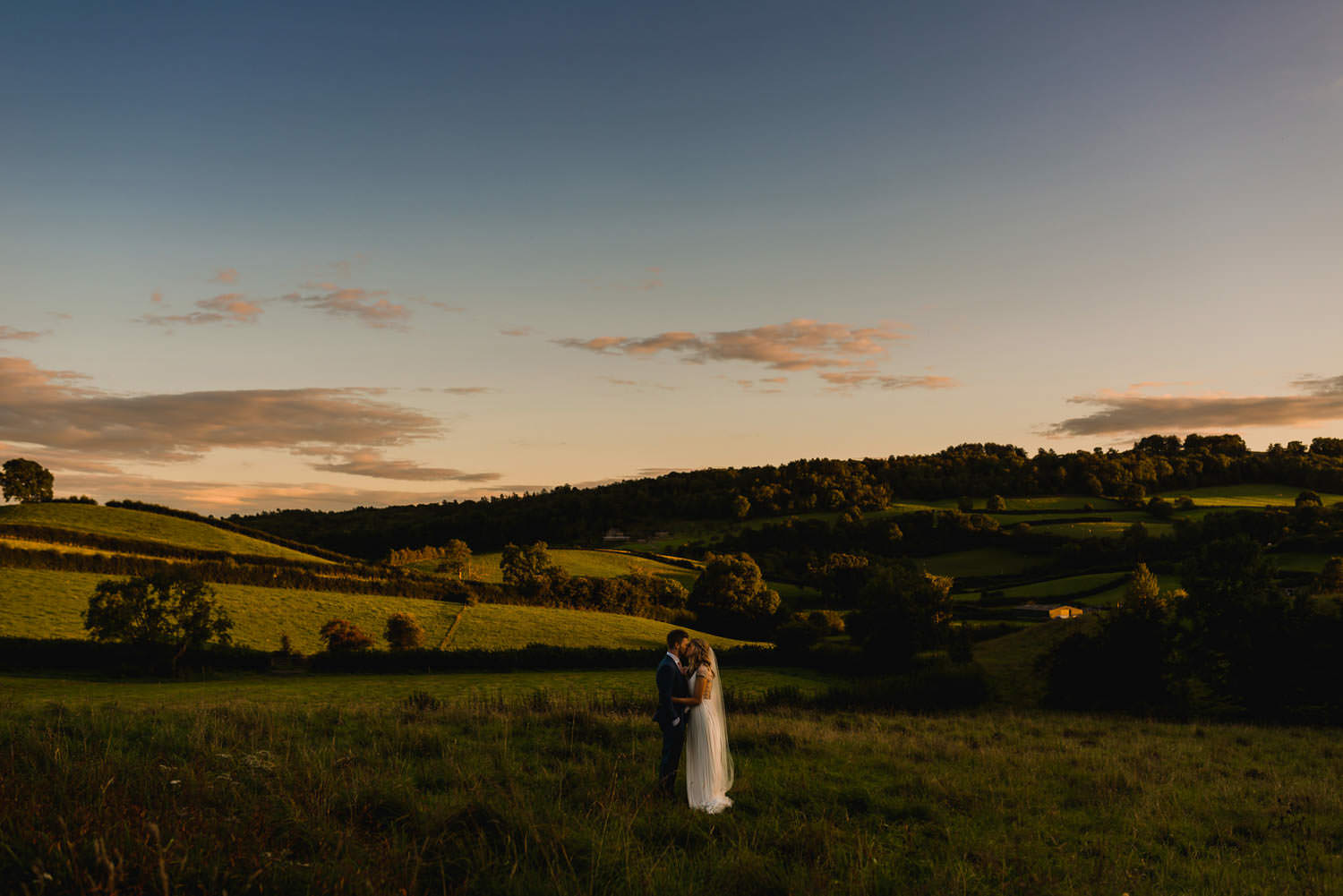 Modern portrait of bride and groom at The Punch Bowl Inn, Lake District