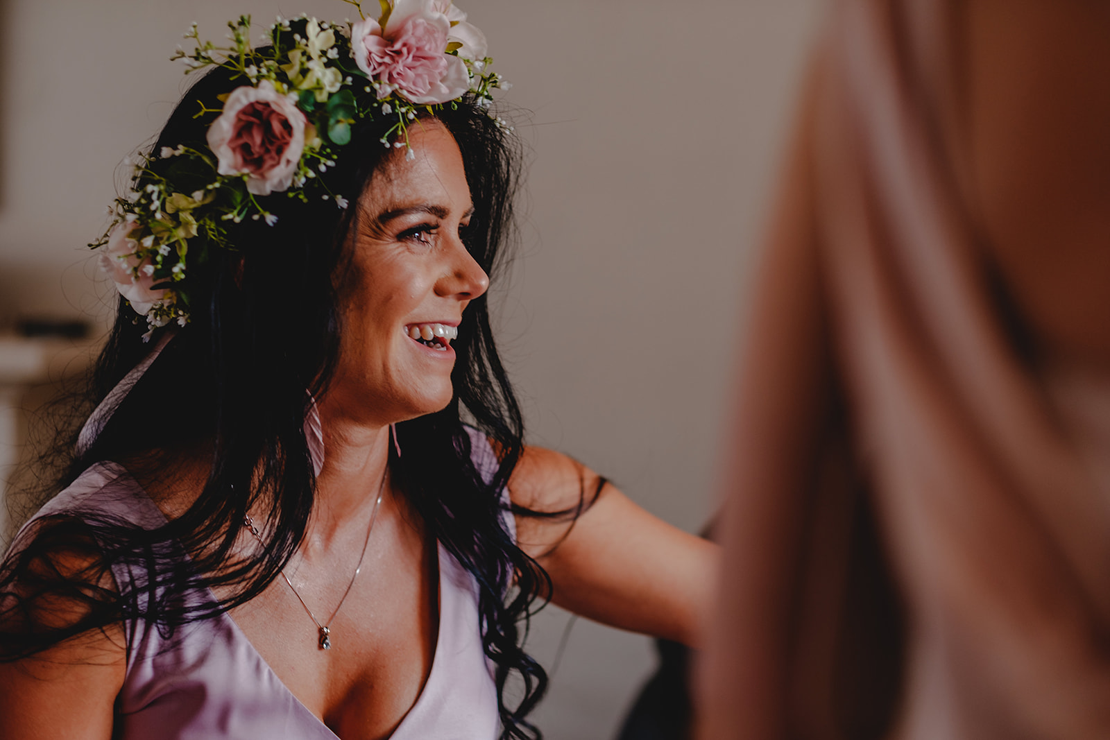 Bridesmaid wearing festival themed hairpiece