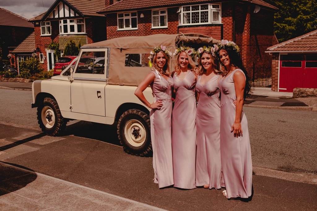 Portrait of girls by Land Rover Defender