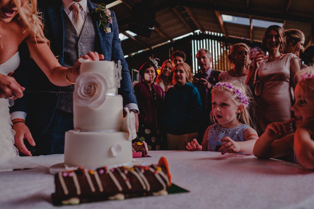 Children admiring wedding cake.