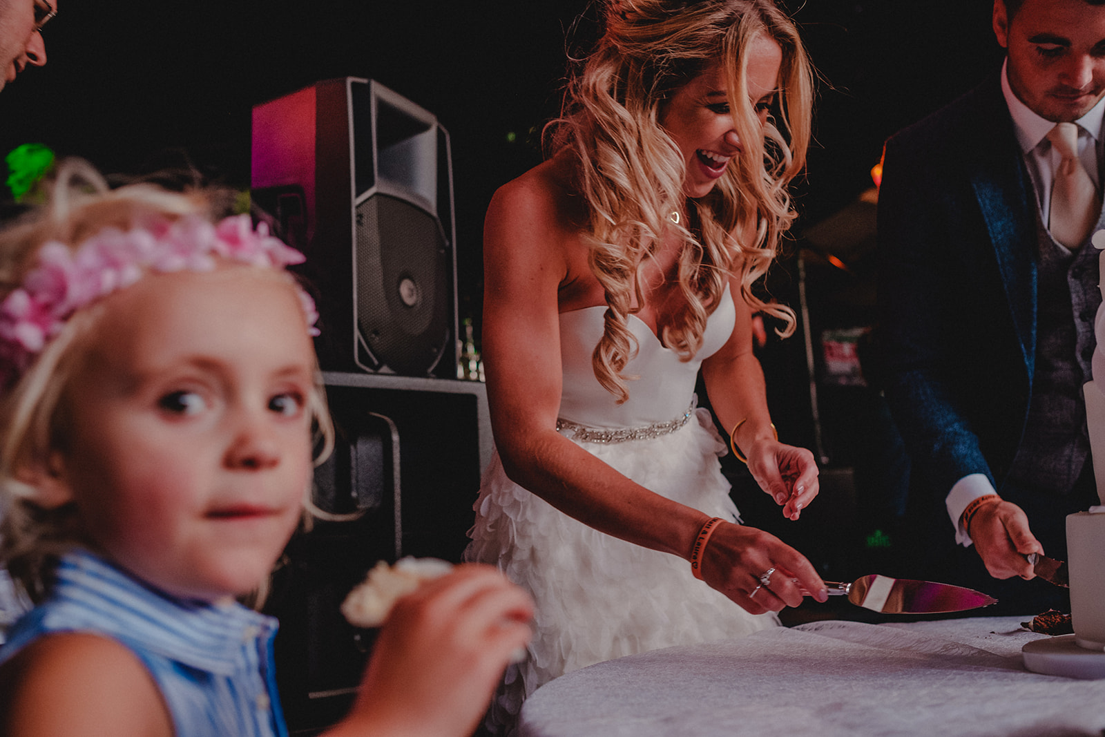 Child eating homemade wedding cake.