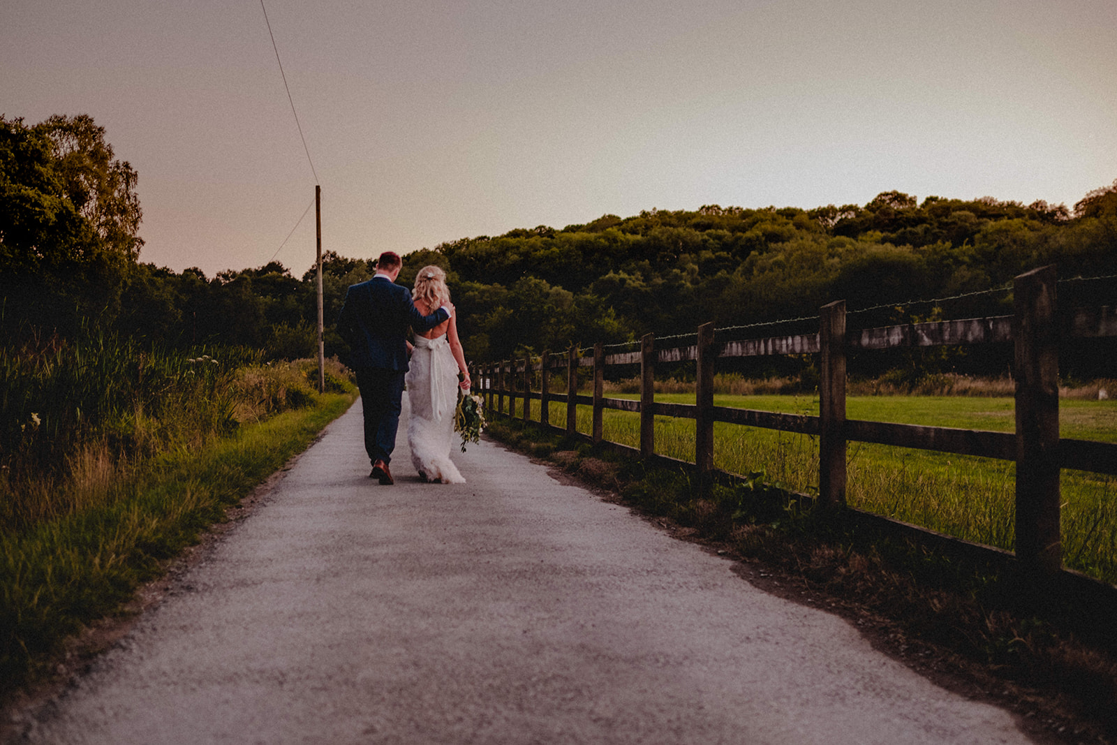 Couple in love walking during a Stockport wedding.