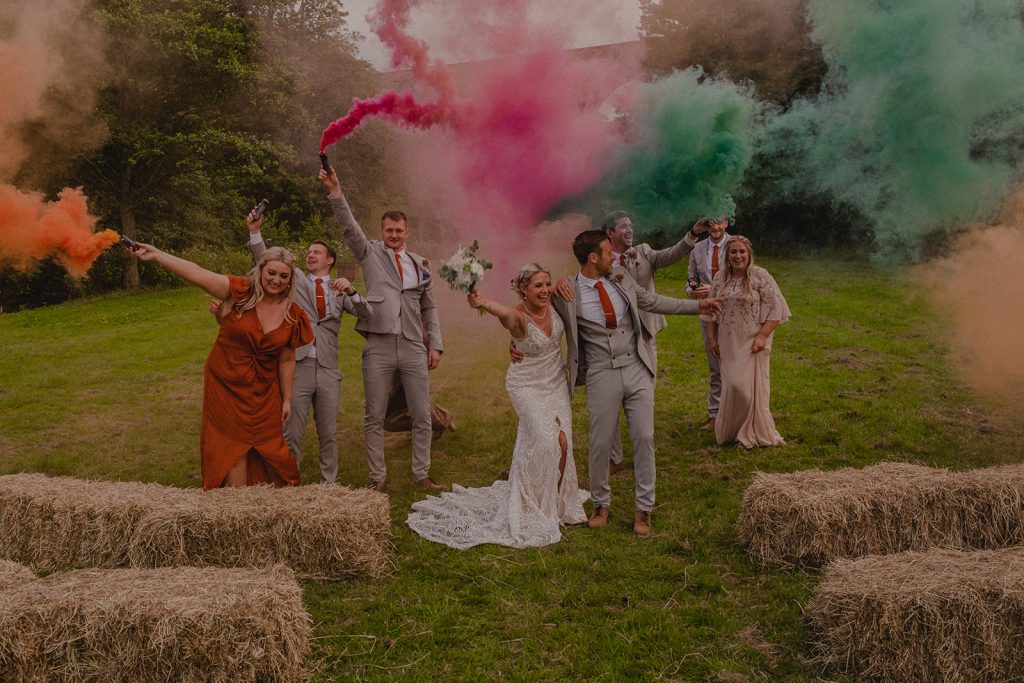 Smoke bombs with the bride and groom wedding at The Roman Lakes.